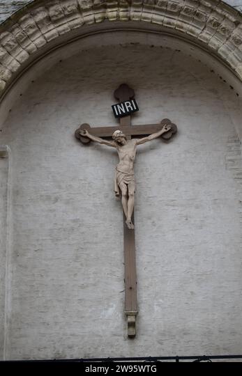 Crucifix with "INRI" inscription on wall.