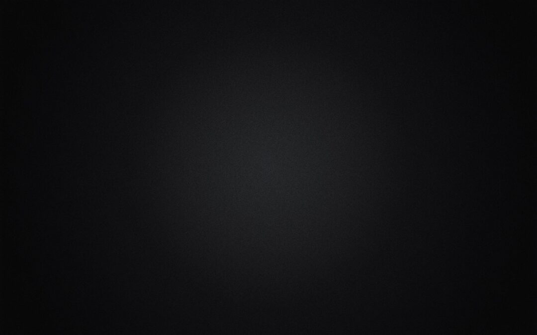 A dark, textured black background with subtle patterns.